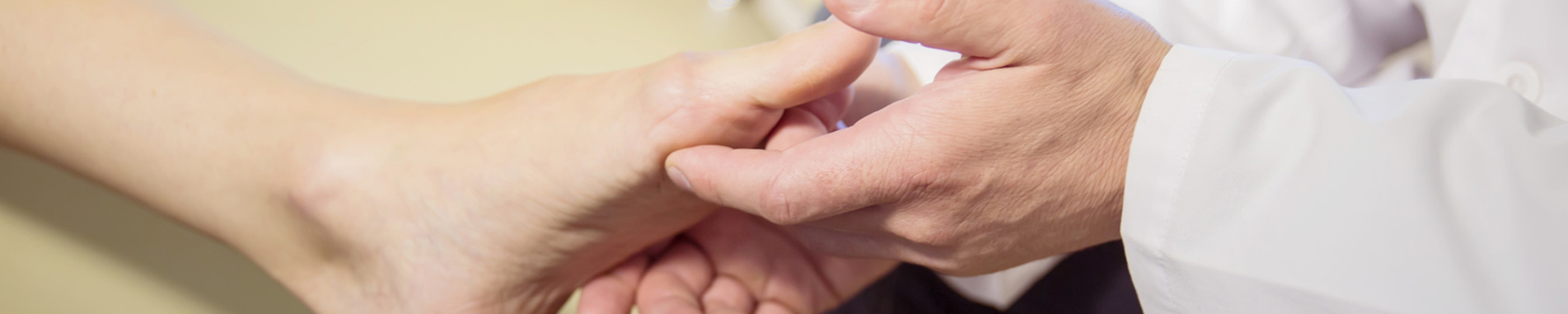 Doctor Looking at Foot